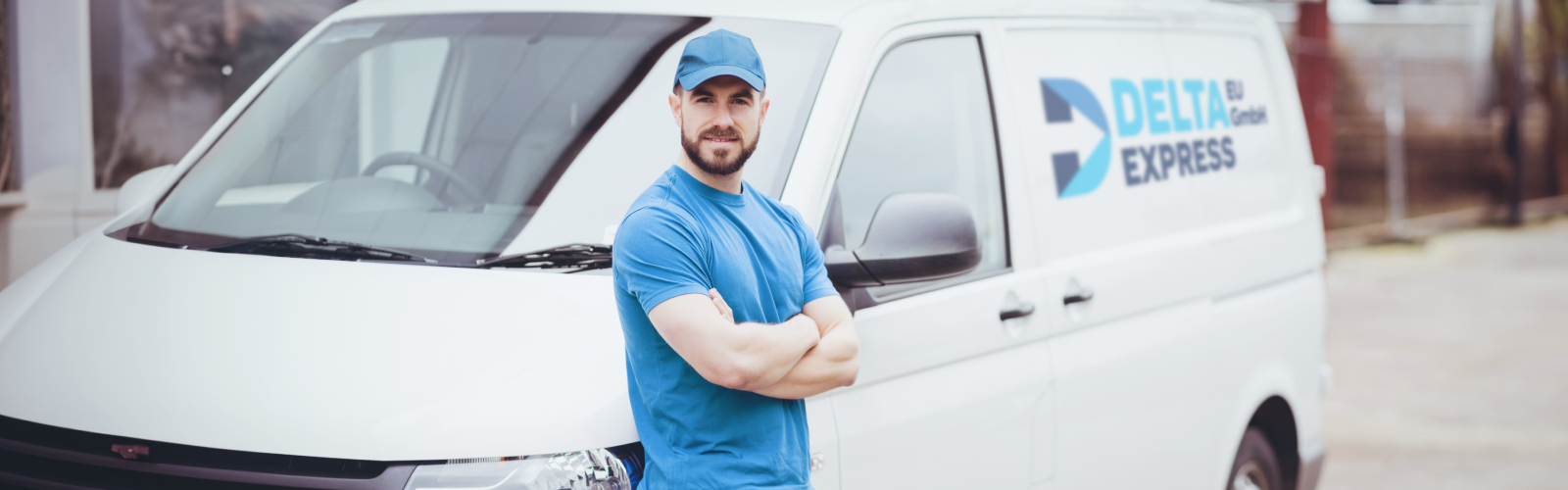 man-leaning-against-his-van-with-arms-crossed